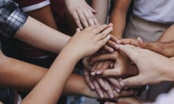 Photo of hands all stacked on top of each other